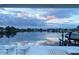 Stunning water view of the bay with boats docked from an outdoor patio at sunset at 440 64Th Ave, St Pete Beach, FL 33706