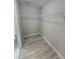 Spacious closet with wire shelving providing ample storage at 1495 Robwood Ter, North Port, FL 34288