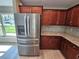 Stainless steel refrigerator in a modern kitchen setting at 1495 Robwood Ter, North Port, FL 34288
