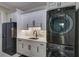 Laundry room with white cabinets, sink and LG appliances at 241 5Th N Ave, Safety Harbor, FL 34695