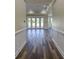 Bright entryway with hardwood floors and French doors leading to backyard at 241 5Th N Ave, Safety Harbor, FL 34695