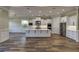 Modern kitchen with white cabinets, large island, and stainless steel appliances at 241 5Th N Ave, Safety Harbor, FL 34695