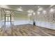 Open living area with hardwood floors and a stone accent wall at 241 5Th N Ave, Safety Harbor, FL 34695