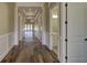 Long hallway with hardwood floors and access to other rooms at 241 5Th N Ave, Safety Harbor, FL 34695
