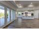 Modern kitchen with white cabinets and island at 241 5Th N Ave, Safety Harbor, FL 34695