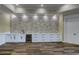 Basement wet bar with stone wall, white cabinetry, and wine cooler at 241 5Th N Ave, Safety Harbor, FL 34695