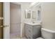 Clean bathroom with gray vanity, shower, and toilet at 4244 Tamargo Dr, New Port Richey, FL 34652
