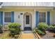 Quaint house exterior with blue shutters and walkway at 4244 Tamargo Dr, New Port Richey, FL 34652
