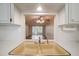 Kitchen with double sink and view into the living room at 4244 Tamargo Dr, New Port Richey, FL 34652