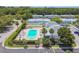 Community pool with surrounding patio and lounge chairs at 4244 Tamargo Dr, New Port Richey, FL 34652