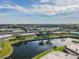 Community view with lake, fountain, and multiple buildings at 4244 Tamargo Dr, New Port Richey, FL 34652