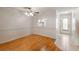 Dining room with laminate floors, ceiling fan, and kitchen pass-through at 4244 Tamargo Dr, New Port Richey, FL 34652