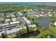 Aerial view of community with waterfront access and lush landscaping at 4244 Tamargo Dr, New Port Richey, FL 34652