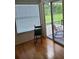 Living room with rocking chair and sliding glass doors at 2367 N Bentley Dr, Palm Harbor, FL 34684