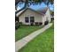 Single story home with landscaped yard and walkway at 2367 N Bentley Dr, Palm Harbor, FL 34684