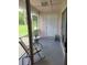 Screened porch with table and chairs at 2367 N Bentley Dr, Palm Harbor, FL 34684