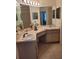 Bathroom with double vanity and large mirror at 2367 N Bentley Dr, Palm Harbor, FL 34684