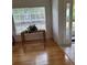 Living room with hardwood floors and large window at 2367 N Bentley Dr, Palm Harbor, FL 34684