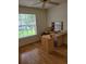 Bright bedroom with wood floors and large window at 2367 N Bentley Dr, Palm Harbor, FL 34684