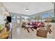 Relaxing sunroom with leather sofa and ample natural light at 13923 Wildwood Dr, Largo, FL 33774