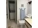 Bathroom with washer, dryer, toilet, and sink at 1245 S Martin Luther King Jr Ave # 304, Clearwater, FL 33756