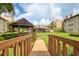 Wooden footbridge leading to community gazebo and lawn at 1245 S Martin Luther King Jr Ave # 304, Clearwater, FL 33756