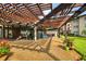 Community patio with pergola, seating, and grilling area at 1245 S Martin Luther King Jr Ave # 304, Clearwater, FL 33756