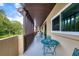 Shared balcony with seating area and lush landscaping at 1245 S Martin Luther King Jr Ave # 304, Clearwater, FL 33756