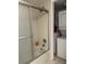 Bathroom with tub, shower, and washer/dryer access at 1245 S Martin Luther King Jr Ave # 304, Clearwater, FL 33756