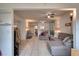 Open living room with sectional sofa, offering a view into the kitchen at 1245 S Martin Luther King Jr Ave # 304, Clearwater, FL 33756