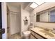 Bathroom with toilet, sink, and linen closet at 1245 S Martin Luther King Jr Ave # 304, Clearwater, FL 33756