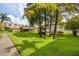 Landscaped lawn with mature trees and a footbridge at 1245 S Martin Luther King Jr Ave # 304, Clearwater, FL 33756