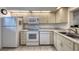Well-equipped kitchen with white cabinets and granite countertops at 1245 S Martin Luther King Jr Ave # 304, Clearwater, FL 33756