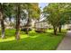Expansive green lawn with mature trees and gazebo at 1245 S Martin Luther King Jr Ave # 304, Clearwater, FL 33756