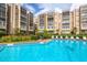 Refreshing community pool with lounge chairs and landscaping at 1245 S Martin Luther King Jr Ave # 304, Clearwater, FL 33756