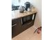 Kitchen island with microwave, coffee maker, and kettle at 701 S Madison Ave # 106, Clearwater, FL 33756