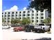 Building exterior with parking lot and several cars at 701 S Madison Ave # 106, Clearwater, FL 33756
