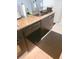 Kitchen featuring granite countertops and dark brown cabinets at 701 S Madison Ave # 106, Clearwater, FL 33756