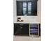Kitchen wet bar with wine cooler and quartz countertop at 12610 Rangeland Blvd, Odessa, FL 33556