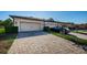 Two-car garage with paver driveway at 12610 Rangeland Blvd, Odessa, FL 33556