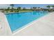 Community lap pool with expansive sundeck and lounge area at 12610 Rangeland Blvd, Odessa, FL 33556