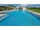 Large community pool with plenty of lounge chairs and seating at 12610 Rangeland Blvd, Odessa, FL 33556