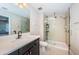 Bathroom with large walk-in shower, modern vanity, and neutral tile at 12610 Rangeland Blvd, Odessa, FL 33556