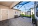Relaxing screened patio with brick pavers and string lights at 12610 Rangeland Blvd, Odessa, FL 33556