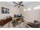 Home office with built-in shelving and ceiling fan at 12610 Rangeland Blvd, Odessa, FL 33556