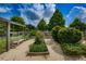 Community garden with a wooden bench and swing at 12610 Rangeland Blvd, Odessa, FL 33556