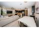 Open concept living space featuring a sectional sofa and dining area at 12610 Rangeland Blvd, Odessa, FL 33556