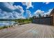 Lake view from a wooden deck with gates at 12610 Rangeland Blvd, Odessa, FL 33556