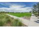 Landscaped community park with paved walkways at 12610 Rangeland Blvd, Odessa, FL 33556