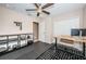 Bright home office with wood desk, ceiling fan, and ample closet space at 12610 Rangeland Blvd, Odessa, FL 33556